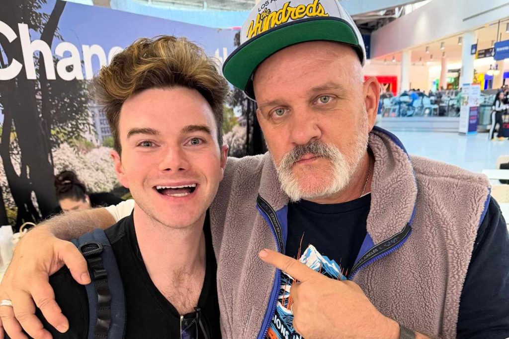 Chris Colfer reunites with 'Glee' father Mike O'Malley at the airport