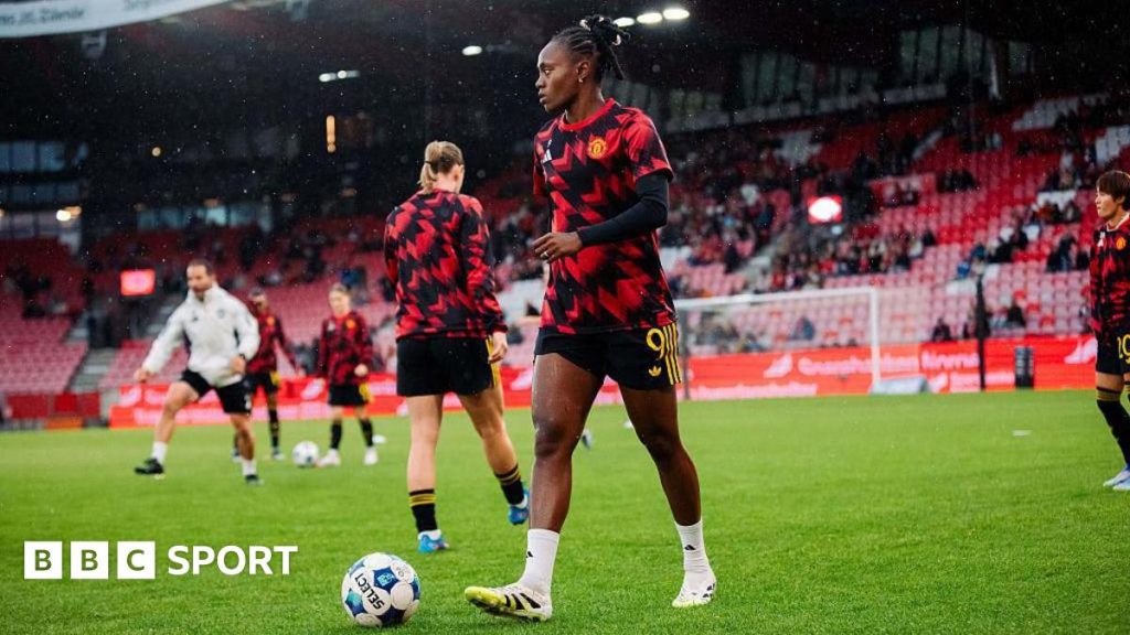 Melvine Malard warming up for Manchester United