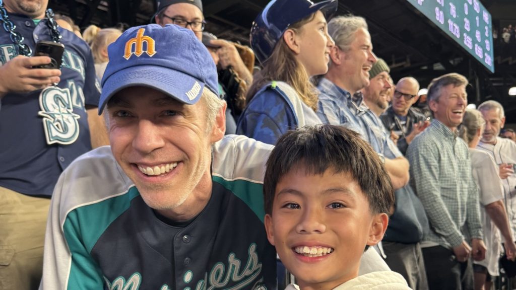 Mariners fan gifts historic ball to young boy : NPR