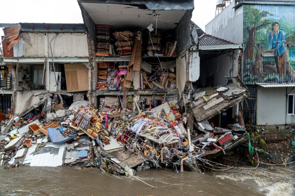 Six dead as floods wreak havoc for tourists in Bali and airport is inundated
