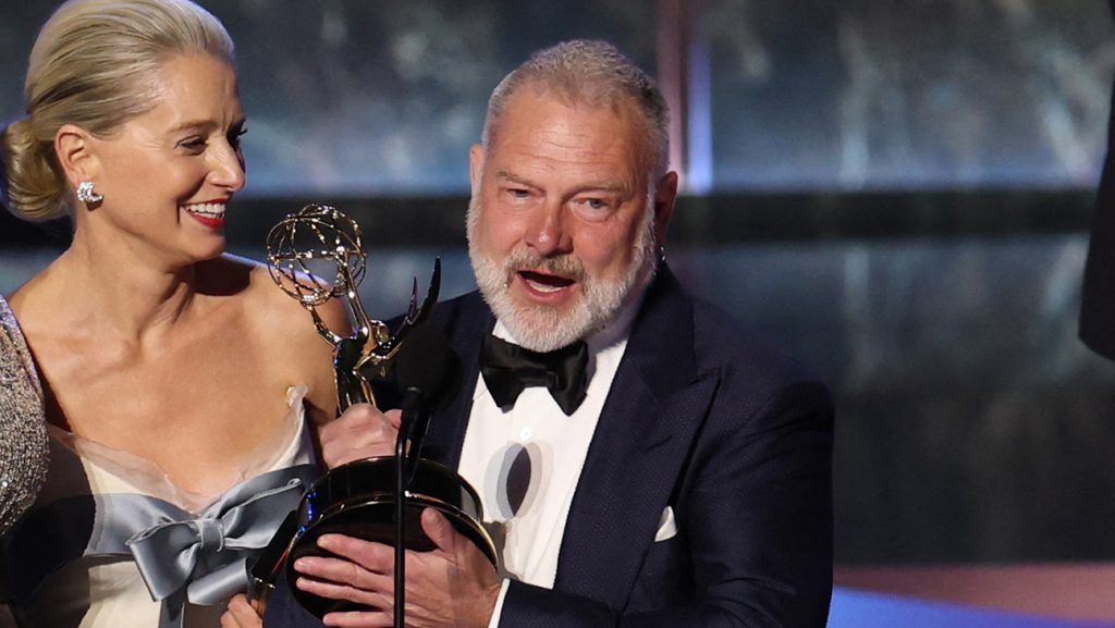 US writer producer R. Scott Gemmill (R) accepts the Outstanding Drama Series award for The Pitt during the 77th Primetime Emmy Awards at the Peacock Theatre at LA Live in Los Angeles on September 14, 2025.