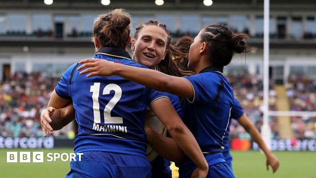 Giada Corradini of Italy celebrates scoring her team's seventh try