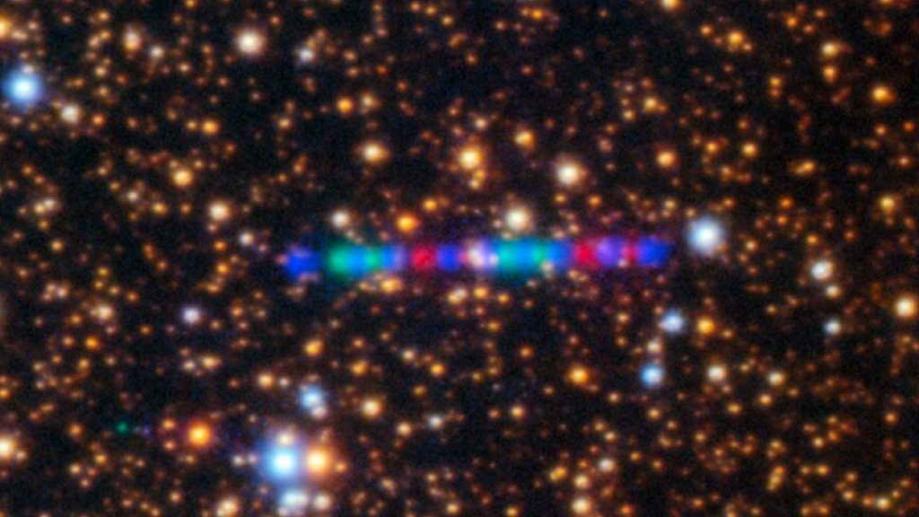 Two spacecraft will pass right through comet 3I/ATLAS’ tail Photograph of a string of blue, red and green lights against a starry background
